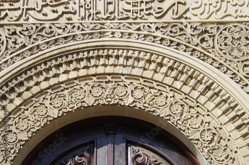 An oriental building facade  with ornaments carved in stone