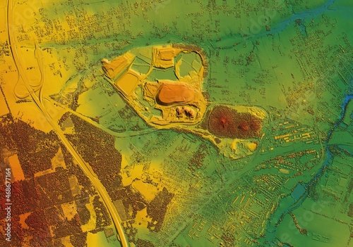 Digital elevation model. GIS 3D illustration made after proccesing aerial pictures taken from a drone. It shows a large opencast mine surrounded by forests and numerous scattered villages