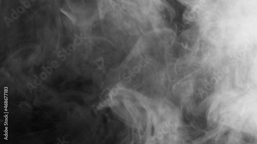 Thick smoke on a black background. Gray fog. Smoke and fire. photo