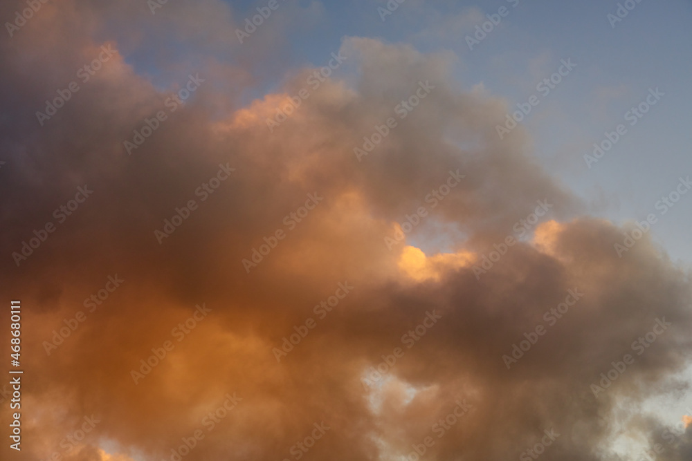 Colorful clouds in the setting sky as a background. Colorful clouds in the setting sky as a background.