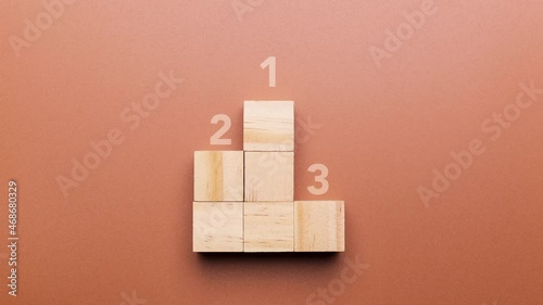 Podium made with wooden cubes and animation of number one, concept of victory and competition, seamless looping
