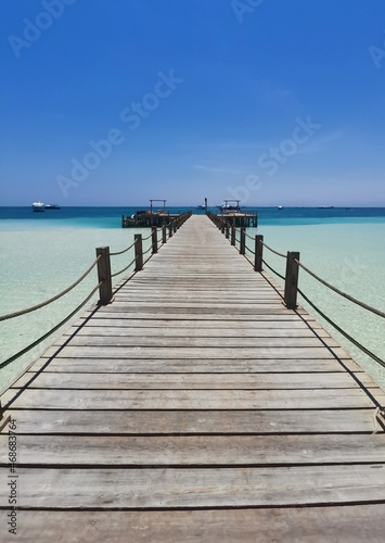 wooden pier on the beach © Ahmed