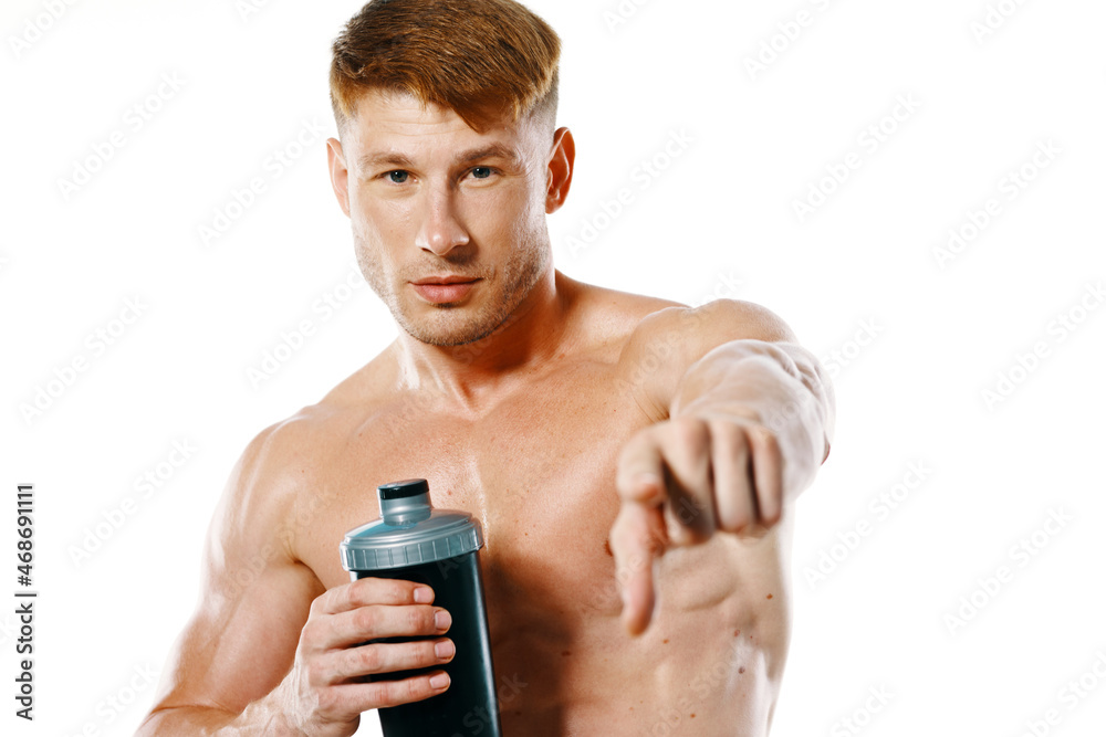 athletic man with a pumped-up torso drink bottle sportspit athletic man with a pumped-up torso drink bottle sportspit