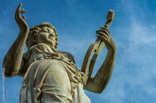 statue playing harp