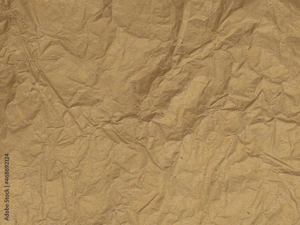 Crumpled cardboard in sepia tones. Old paper texture. Destroyed surface. Crumpled cardboard in sepia tones. Old paper texture. Destroyed surface.