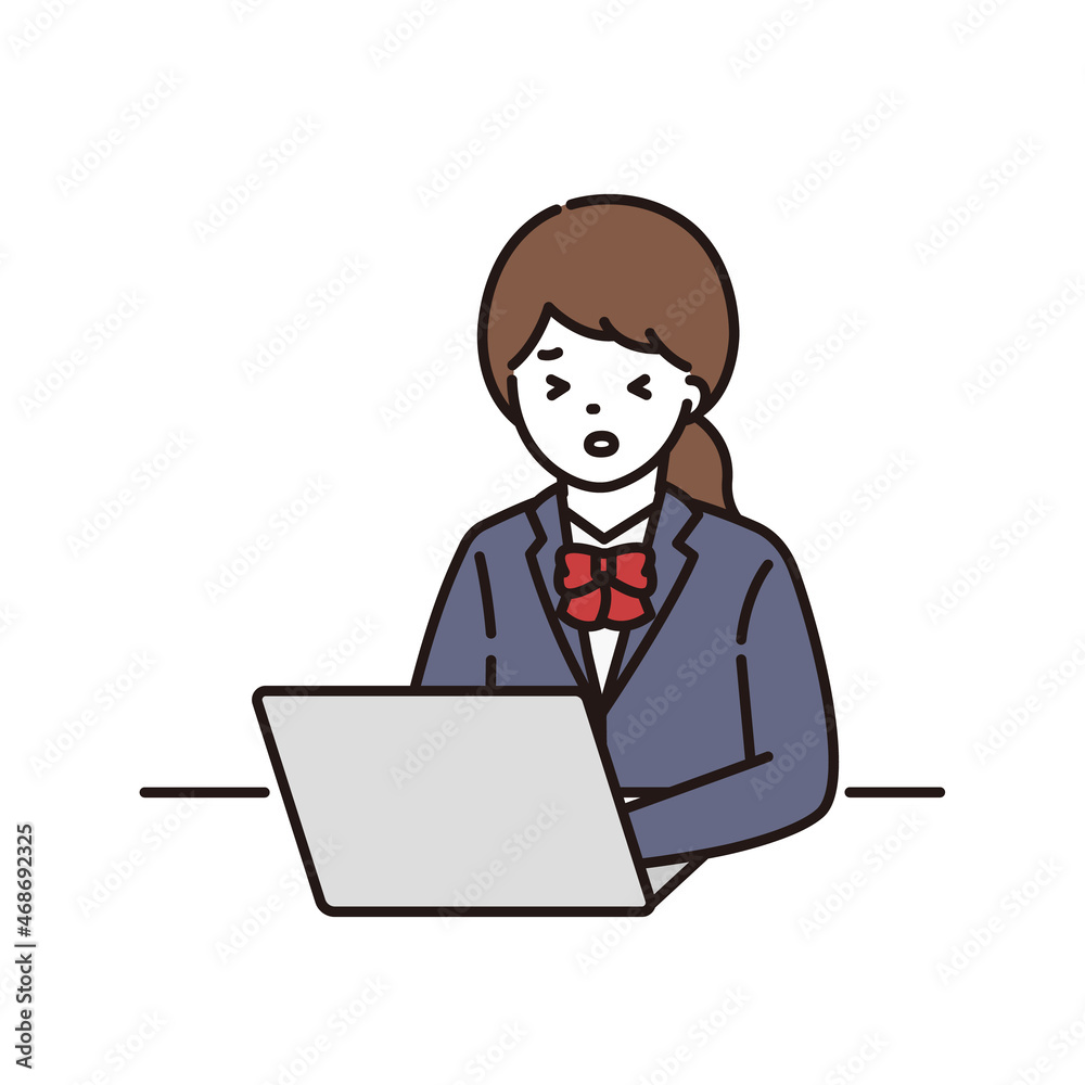 パソコンの前で困っている学生服の女子高校生・中学生 パソコンの前で困っている学生服の女子高校生・中学生