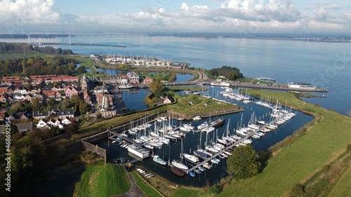 Dutch fortress city of Willemstad in North Brabant with a view of the old harbor. Sailing boats for pleasure craft in the harbor on the Haringvliet. photo