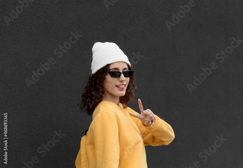 Young woman wearing beanie ...
