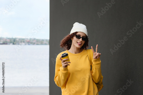 Happy woman wearing beanie ...