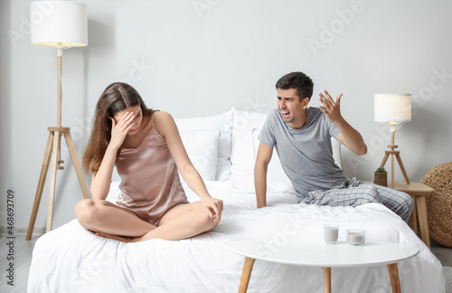 Angry young man shouting at...