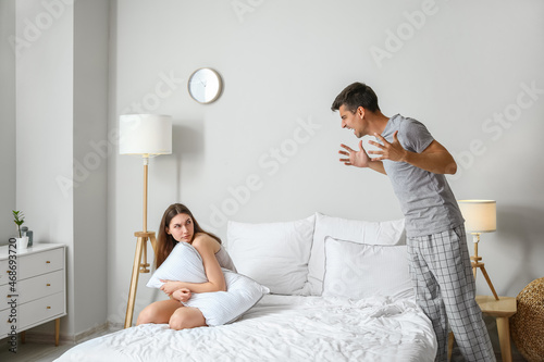 Angry young man shouting at...