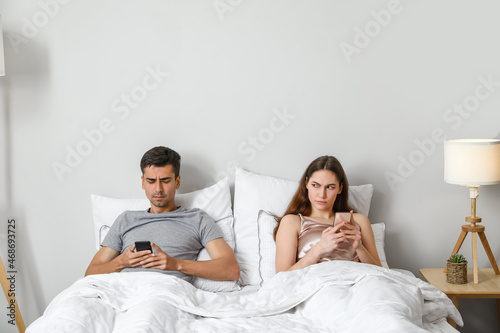 Young couple using mobile p...