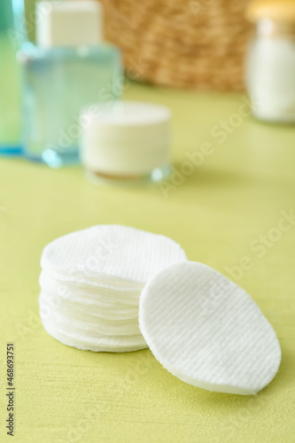 New clean cotton pads on table, closeup