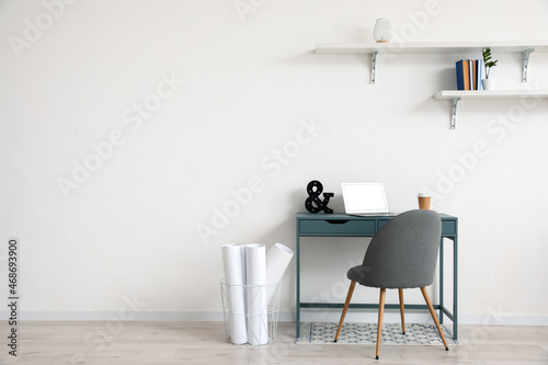 Stylish workplace near wall in room © Pixel-Shot
