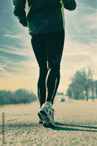 torso, buttocks and legs of an urban runner woman