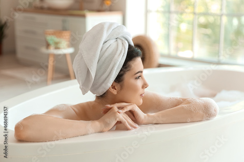 Relaxed young woman taking ...