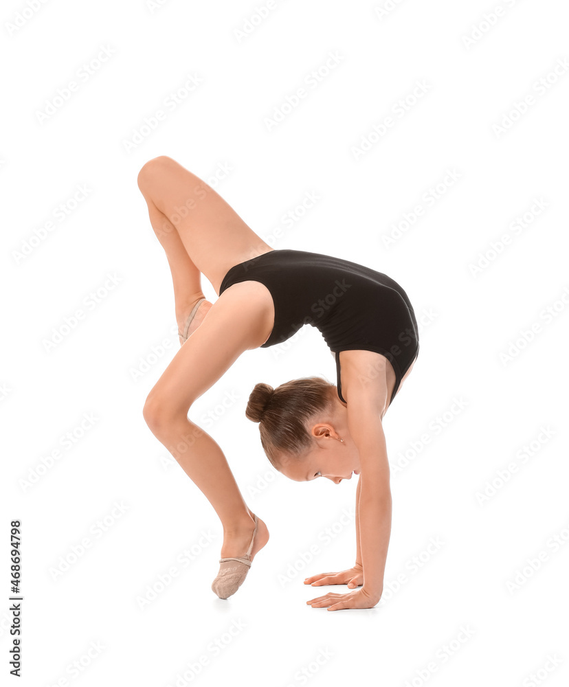 Fototapeta premium Little girl doing gymnastics on white background