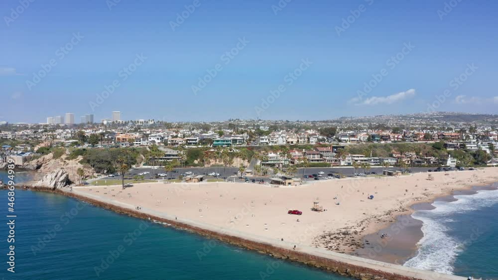beachscape of Newport, CA, with city buildings and bay estuary. Drone aerial beachscape of Newport, CA, with city buildings and bay estuary. Drone aerial
