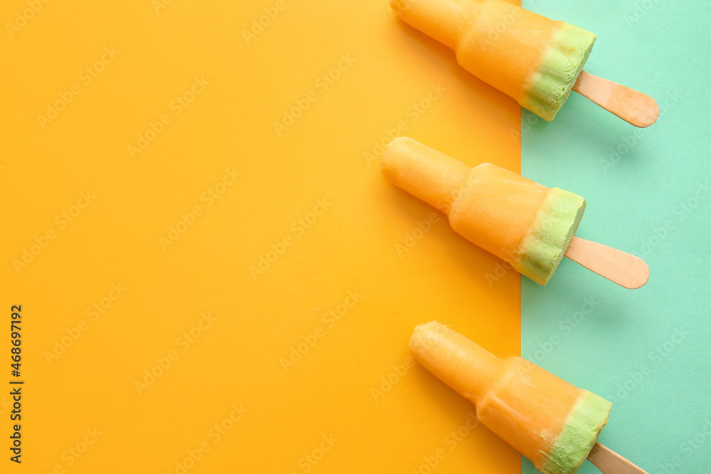 Tasty melon popsicles on color background Tasty melon popsicles on color background