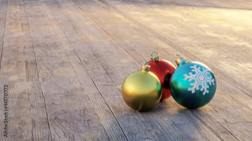 Close up view of 3 Christmas balls on wooden floor