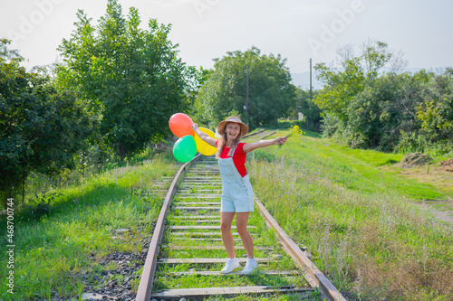 one girl with balls on the railroad goes © Vyacheslav