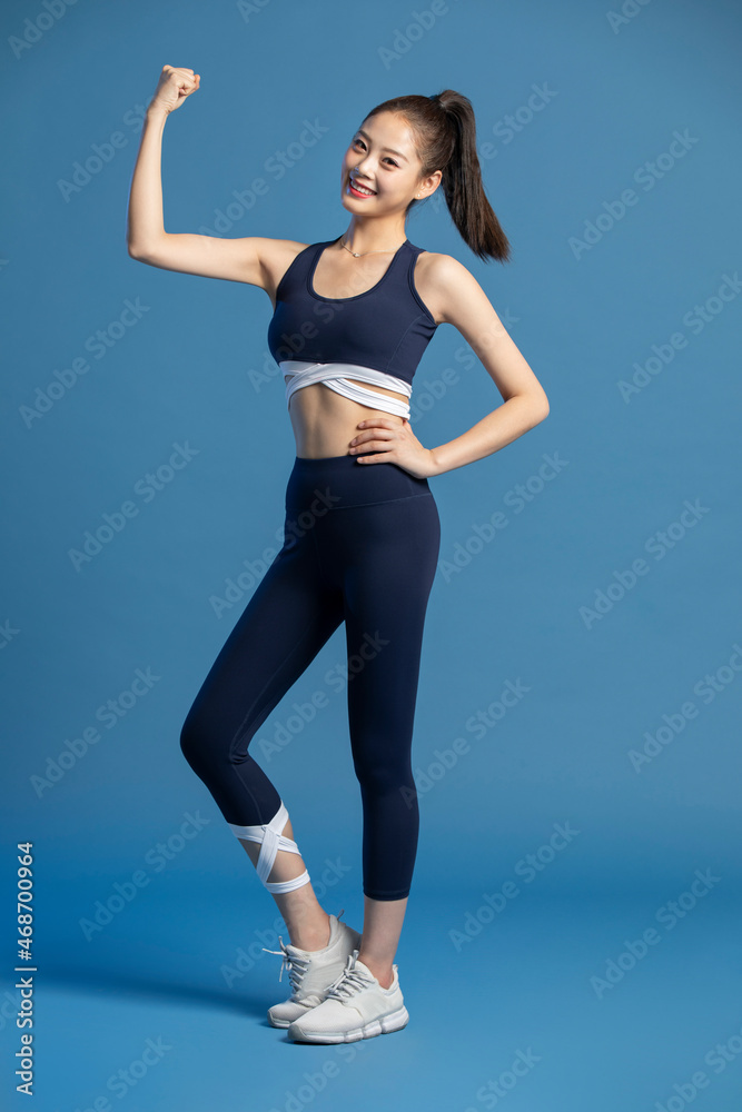Cheerful young woman exercising Cheerful young woman exercising