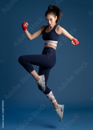 Confident young woman in hand wraps photo