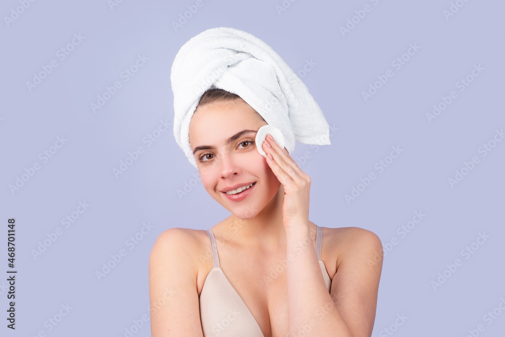 Portrait of young beautiful woman after bath. Beauty face of a cheerful attractive girl with towel on head, isolated. Moisturized healthy skin, morning spa, beauty routine, facial skincare treatment. Portrait of young beautiful woman after bath. Beauty face of a cheerful attractive girl with towel on head, isolated. Moisturized healthy skin, morning spa, beauty routine, facial skincare treatment.