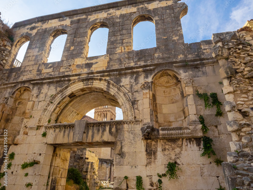 Giant stone wall with empty arched windows in structure surrounding Split, Croatia 
