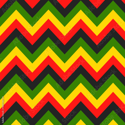 Jamaican color zigzag seamless pattern. Chevron Rastafarian on classic rasta reggae colors background. Vector illustration wallpaper. photo