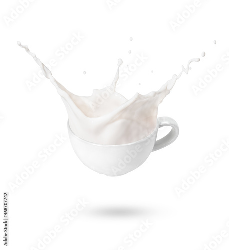 Cup of milk splash isolated on white