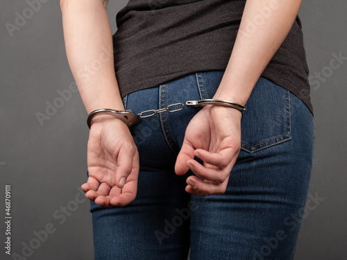 arrested girl in handcuffs, woman convicted of a crime.