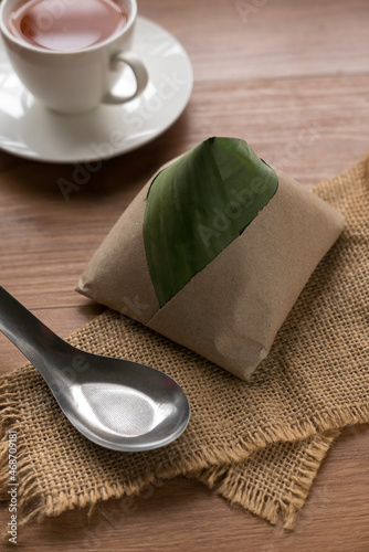 Nasi lemak , a popular malaysia breakfast serve with a cup of tea. photo