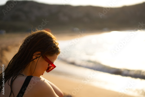 woman in a black swimsuit on the beach sea Summer vacation © VICHIZH