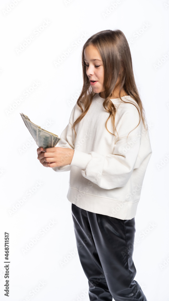 a girl holding a lot of dollars, opened her mouth in surprise. isolated white background a girl holding a lot of dollars, opened her mouth in surprise. isolated white background