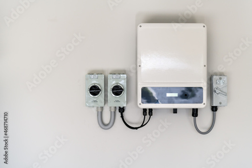 New solar panel inverter with isolators attached to the wall