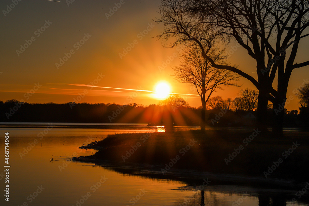 Sunset over the lake near the river Sunset over the lake near the river