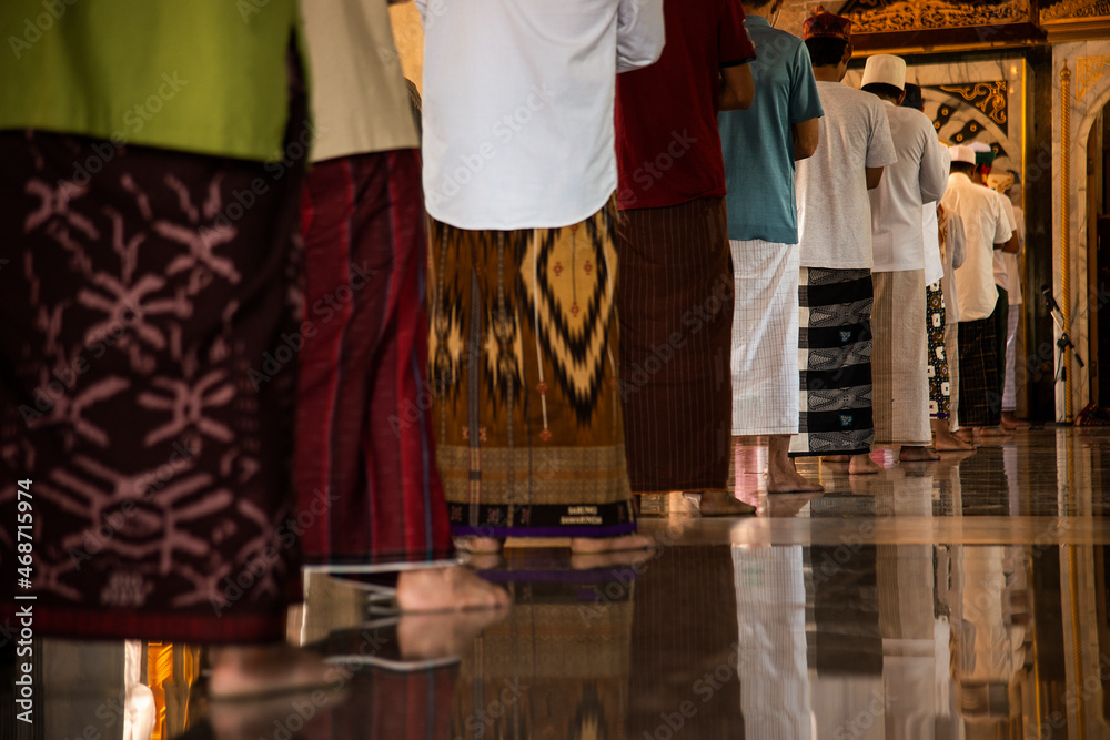 Muslim man praying and prostrating In the mosque that is the teaching of the Prophet Muhammad. Muslim man praying and prostrating In the mosque that is the teaching of the Prophet Muhammad.