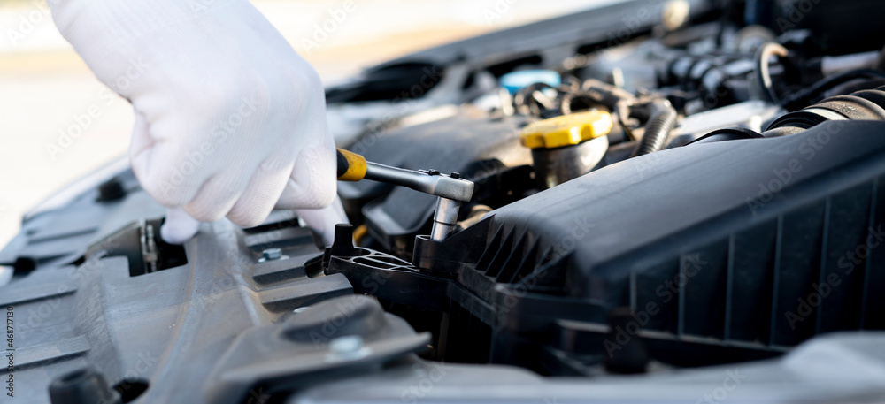 auto mechanic engineer hands holding a wrench to fix some problems auto mechanic engineer hands holding a wrench to fix some problems