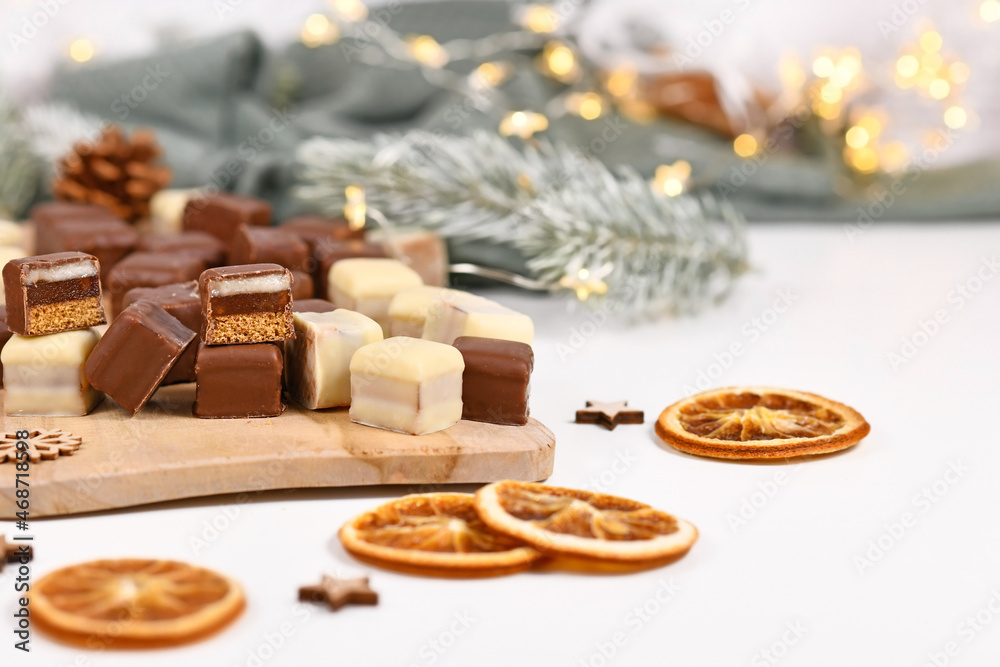 German sweets called 'Dominosteine'. Christmas candy consisting of gingerbread, jelly and marzipan layers covered with chocolate icing German sweets called 'Dominosteine'. Christmas candy consisting of gingerbread, jelly and marzipan layers covered with chocolate icing