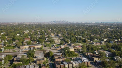 Drone Descends in Chicago's Southside with View of Skyline in Distance photo