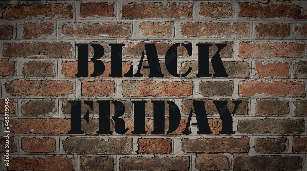 Red brick wall with black lettering BLACK FRIDAY. Sales concept Red brick wall with black lettering BLACK FRIDAY. Sales concept