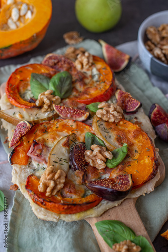 home made autumn pizza with pumpkin and figs