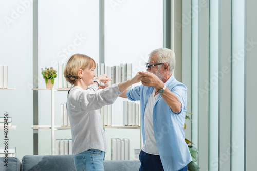 Elderly couple dancing together with happy and romantic emotion.