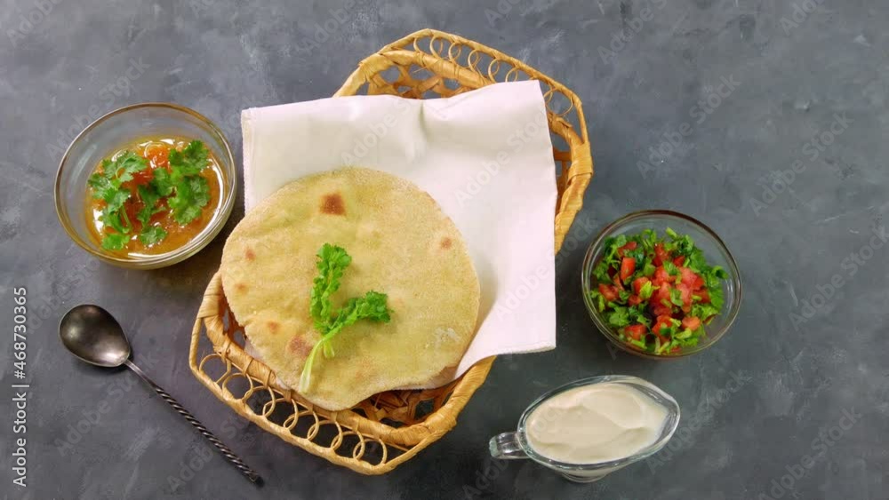 Stockvideon Homemade corn flatbread female hand cilantro greens tomato
