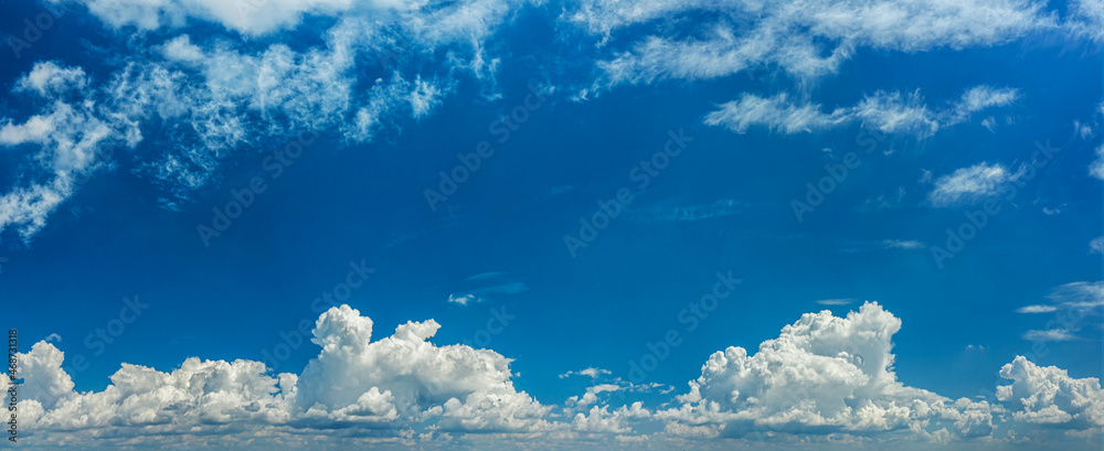 Deep blue sky and different types of white clouds in it. Beautiful nature background.