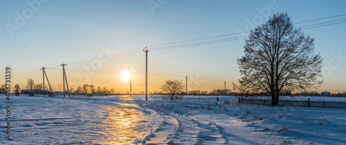 Fototapeta Naklejka Na Ścianę i Meble -  Winter out of the big city. Snowy rural winter landscape.