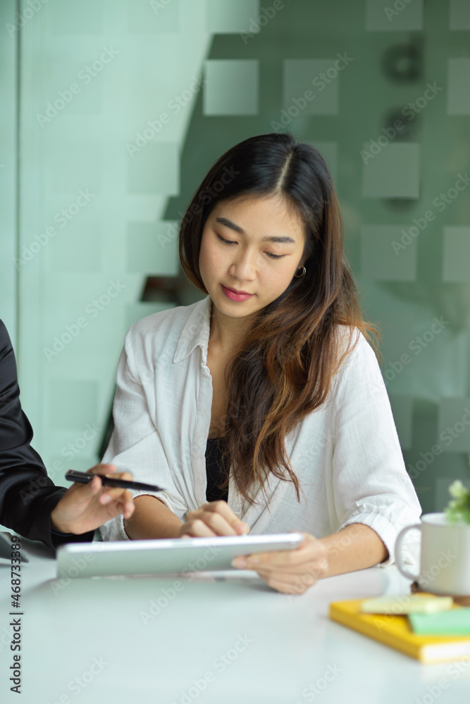 Portrait picture of a young Asian businesswoman in the meeting. Portrait picture of a young Asian businesswoman in the meeting.