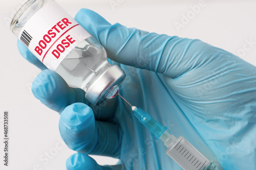 Canvas Print Hand of medical worker preparing for taking a booster shot of vaccine