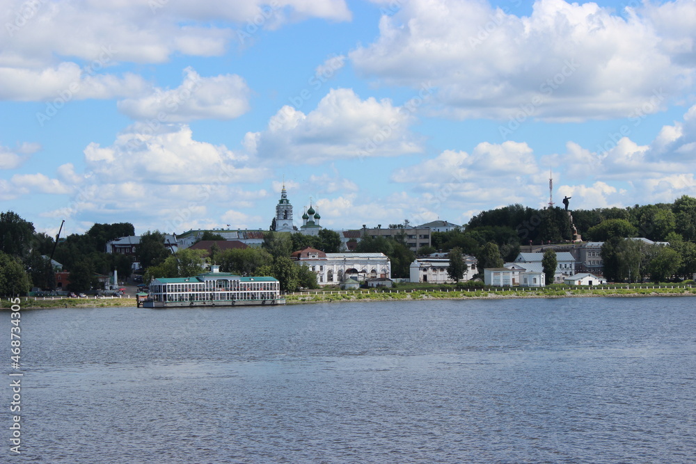 The Volga River. View from the ship to the city of Kostroma - a berth for ships and several buildings.